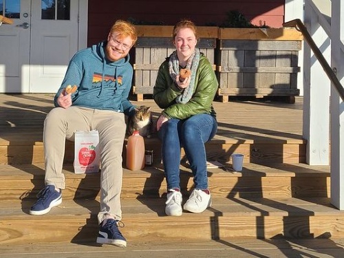 couple farm store steps